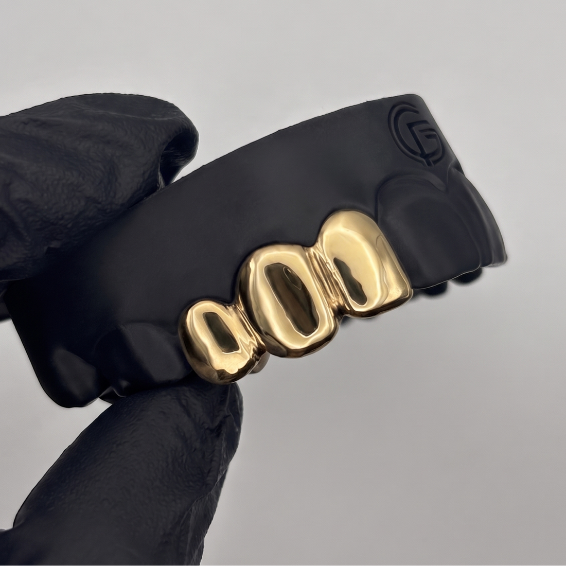 Custom 3 piece solid gold grillz set handcrafted in New Zealand