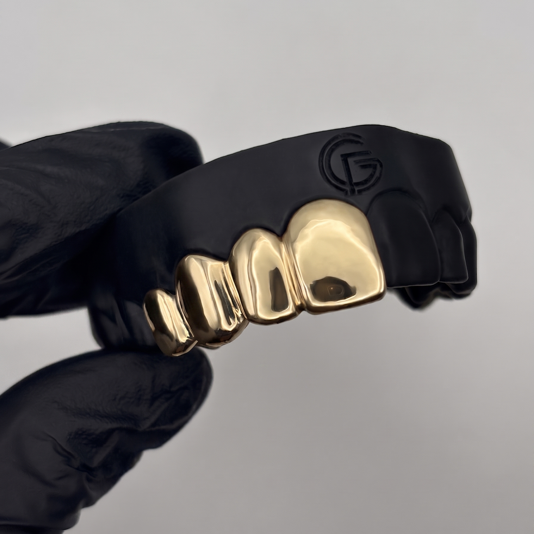 Custom 4 piece solid gold grillz set handcrafted in New Zealand