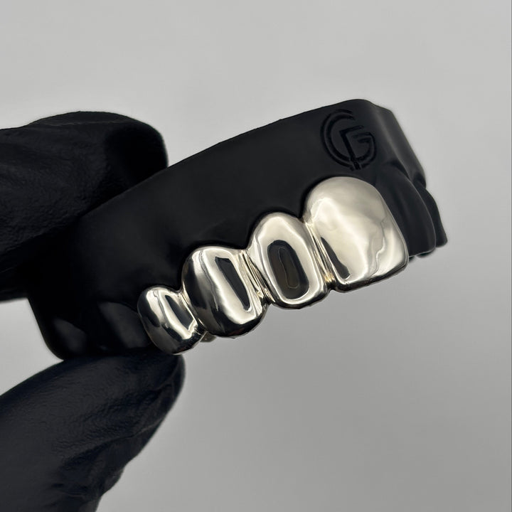 Custom 4 piece sterling silver grillz set handcrafted in New Zealand