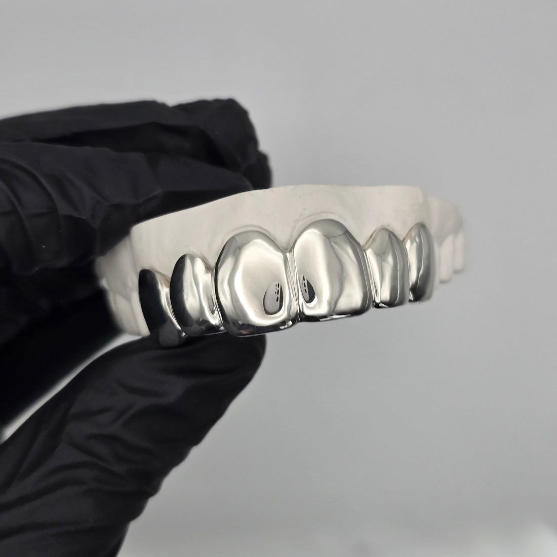 Custom 6 piece sterling silver grillz set handcrafted in New Zealand