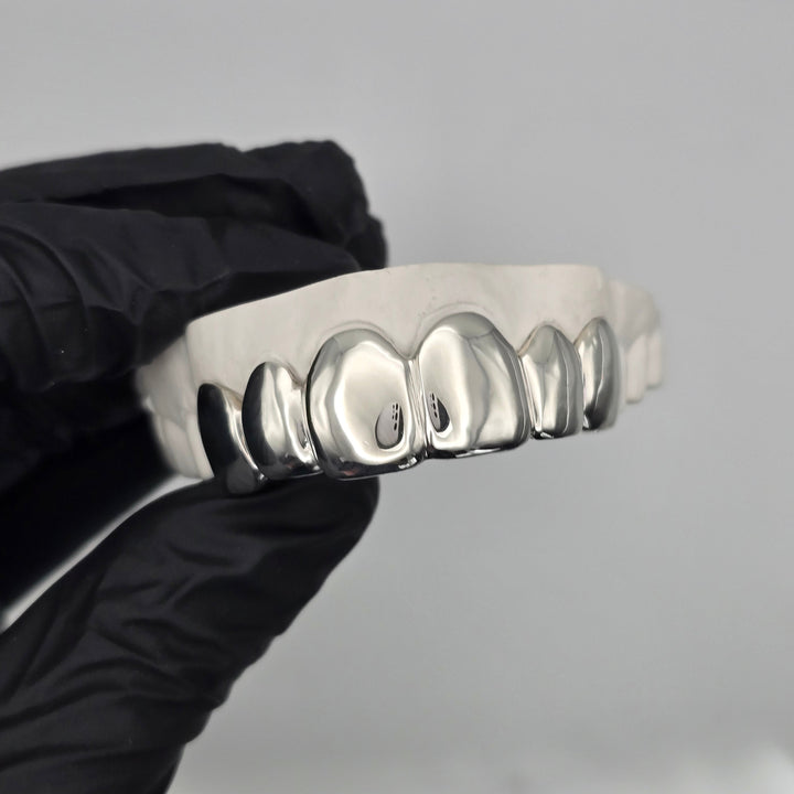 Custom 6 piece sterling silver grillz set handcrafted in New Zealand